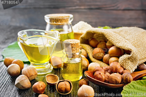 Image of Oil hazelnut in vial on wooden board