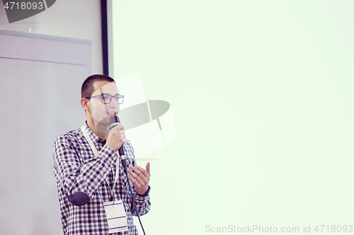 Image of businessman giving presentations at conference room