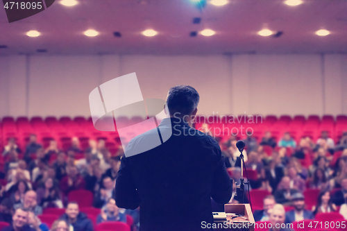 Image of businessman giving presentations at conference room