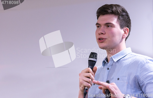 Image of businessman giving presentations at conference room