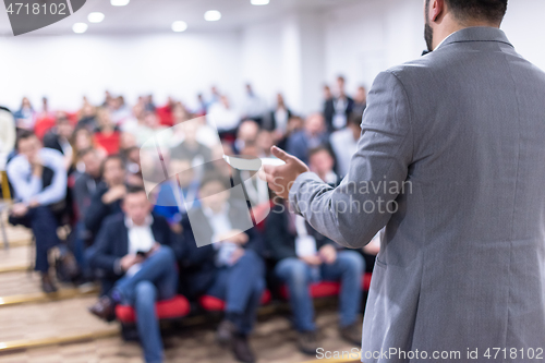 Image of businessman giving presentations at conference room