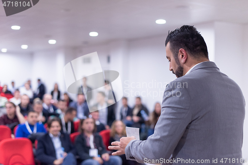 Image of businessman giving presentations at conference room