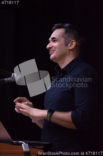 Image of businessman giving presentations at conference room