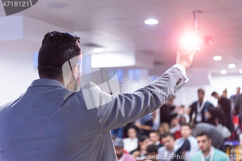 Image of businessman giving presentations at conference room