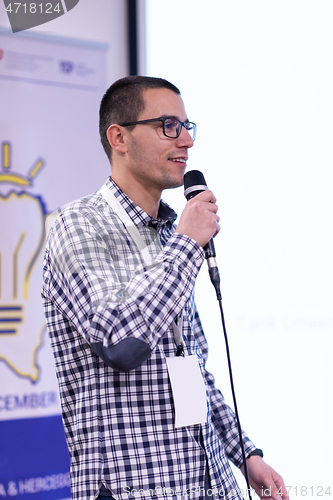 Image of businessman giving presentations at conference room