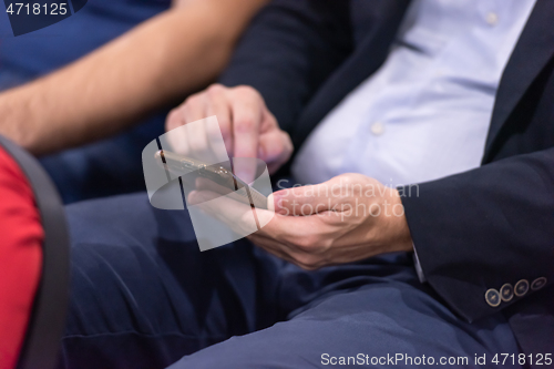 Image of business people hands using smart phone