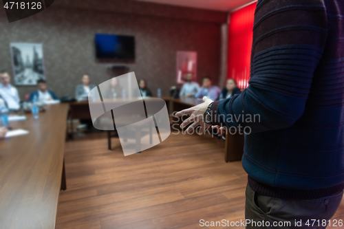 Image of businessman giving presentations at conference room