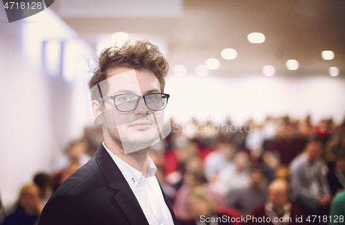 Image of businessman giving presentations at conference room