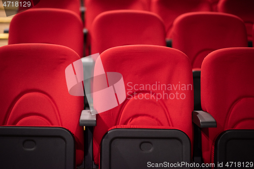 Image of hall with rows of red seats