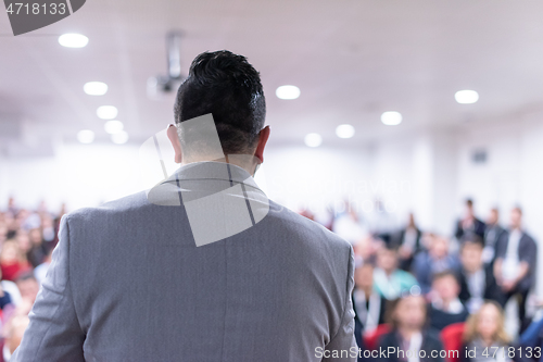 Image of businessman giving presentations at conference room