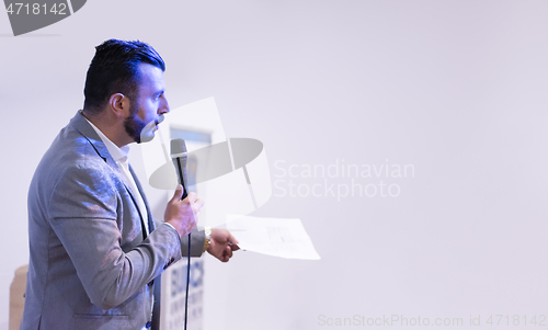 Image of businessman giving presentations at conference room