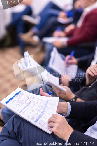 Image of business people taking notes