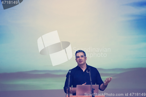 Image of businessman giving presentations at conference room