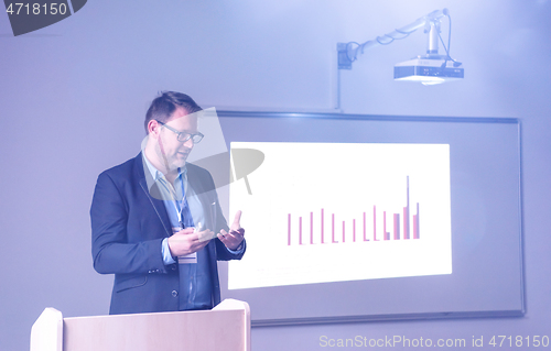 Image of businessman giving presentations at conference room