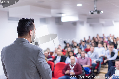 Image of businessman giving presentations at conference room