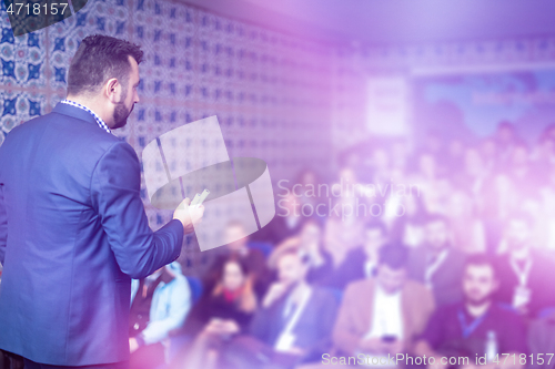 Image of businessman giving presentations at conference room