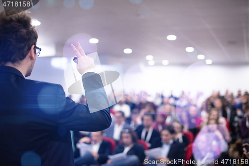 Image of businessman giving presentations at conference room