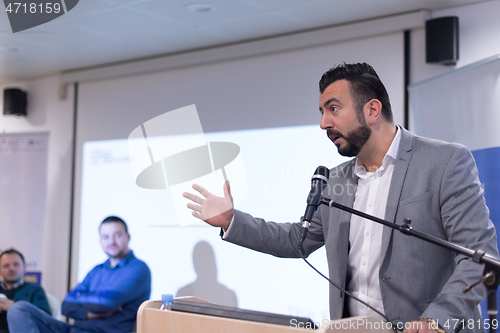 Image of businessman giving presentations at conference room