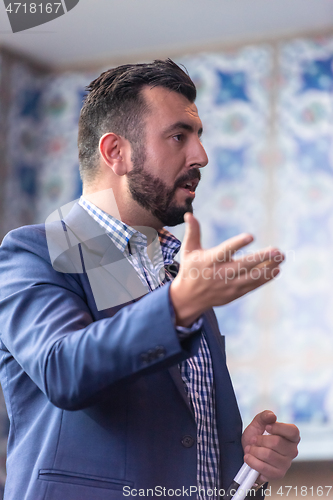 Image of businessman giving presentations at conference room