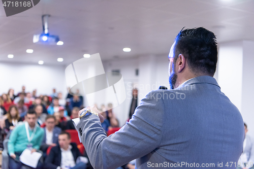 Image of businessman giving presentations at conference room