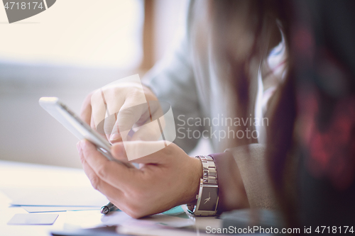 Image of business people hands using smart phone