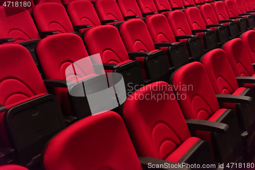 Image of hall with rows of red seats