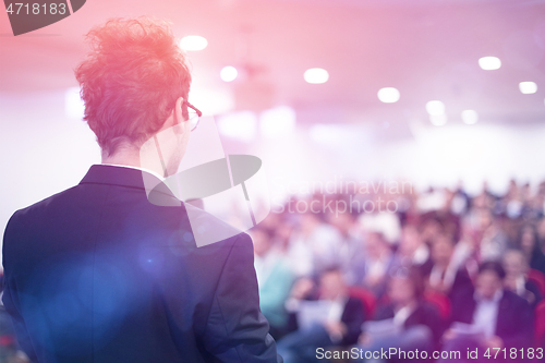 Image of businessman giving presentations at conference room