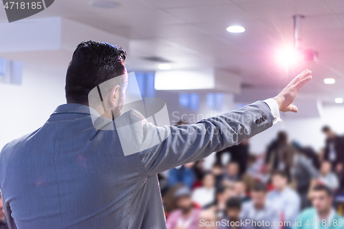 Image of businessman giving presentations at conference room