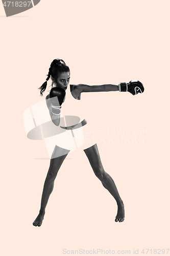 Image of Fit beautiful woman with the boxing gloves, creative collage