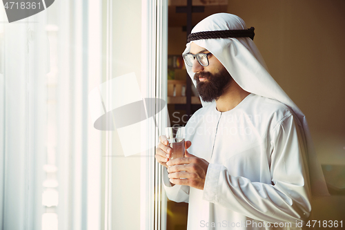 Image of Arabian saudi businessman working in office