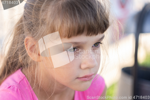 Image of Portrait of a pensive European girl eight years old