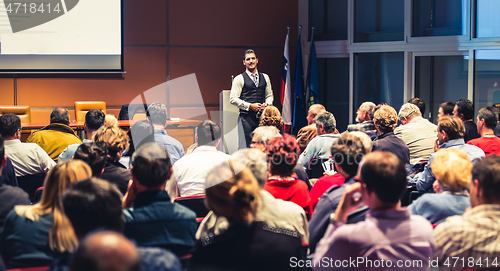 Image of Business speaker giving a talk at business conference meeting event.