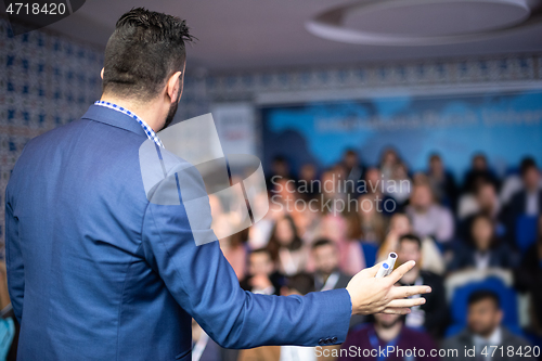 Image of businessman giving presentations at conference room