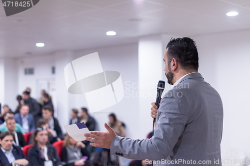 Image of businessman giving presentations at conference room