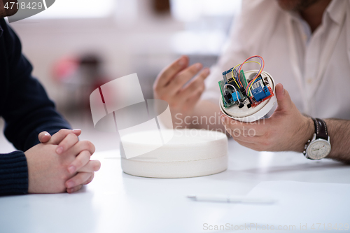 Image of engineers working and discussing about project