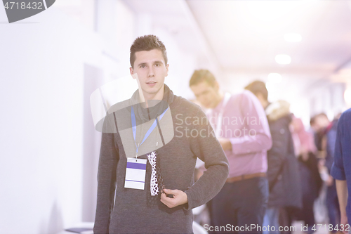 Image of young engineer showing 3D printed model