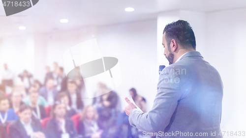 Image of businessman giving presentations at conference room