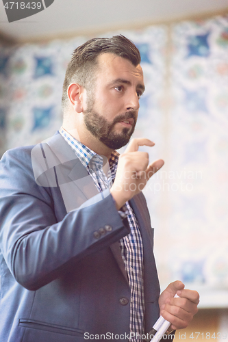 Image of businessman giving presentations at conference room