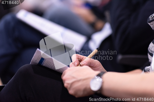 Image of business people taking notes