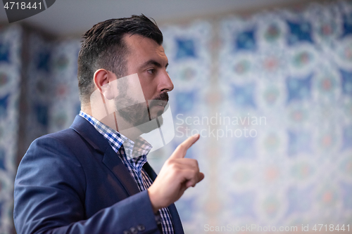 Image of businessman giving presentations at conference room