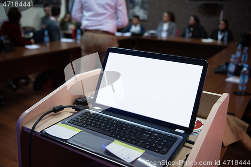 Image of laptop computer at podium