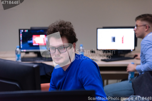 Image of businessman working using a computer in startup office