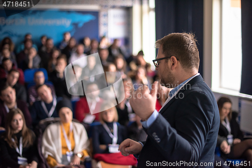 Image of businessman giving presentations at conference room