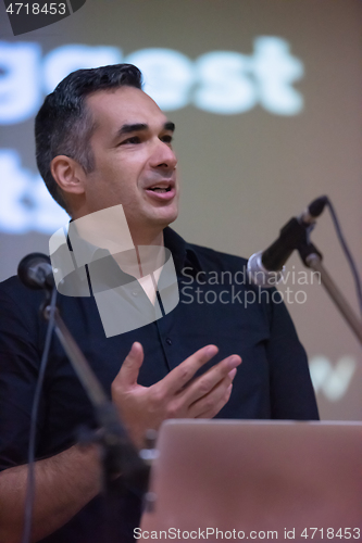 Image of businessman giving presentations at conference room