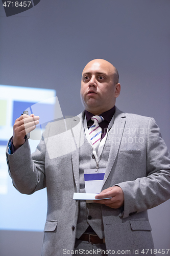 Image of businessman giving presentations at conference room