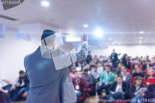 Image of businessman giving presentations at conference room