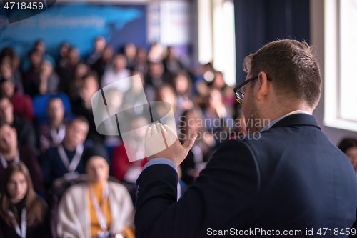 Image of businessman giving presentations at conference room