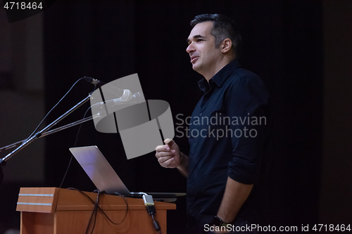 Image of businessman giving presentations at conference room