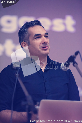 Image of businessman giving presentations at conference room