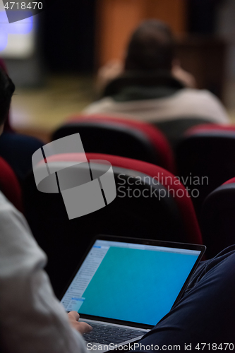 Image of business people hands using laptop computer